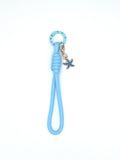 Porte clés en macramé bleu avec étoile  de mer