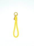 Porte clés en macramé jaune avec oeil