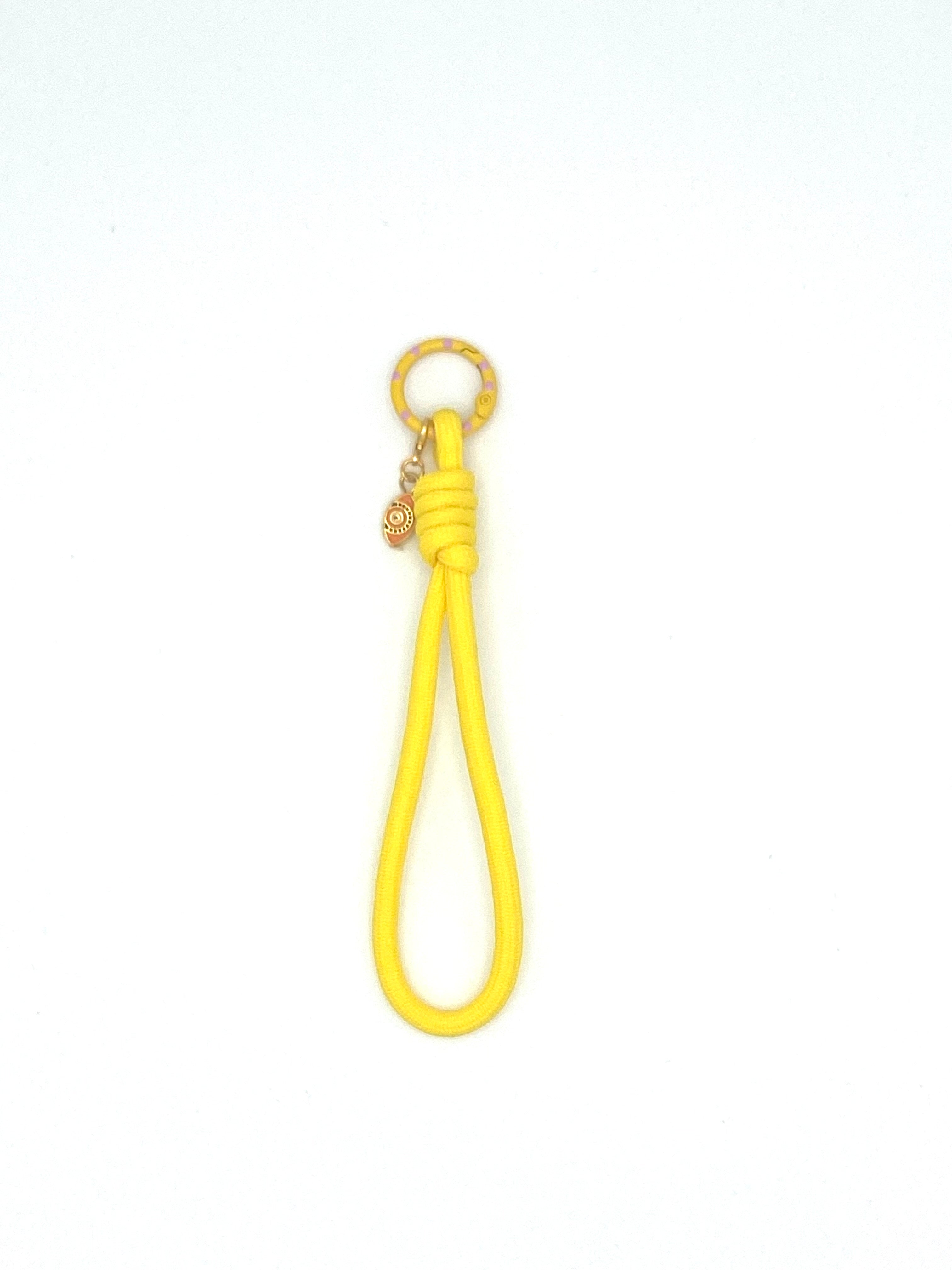 Porte clés en macramé jaune avec oeil