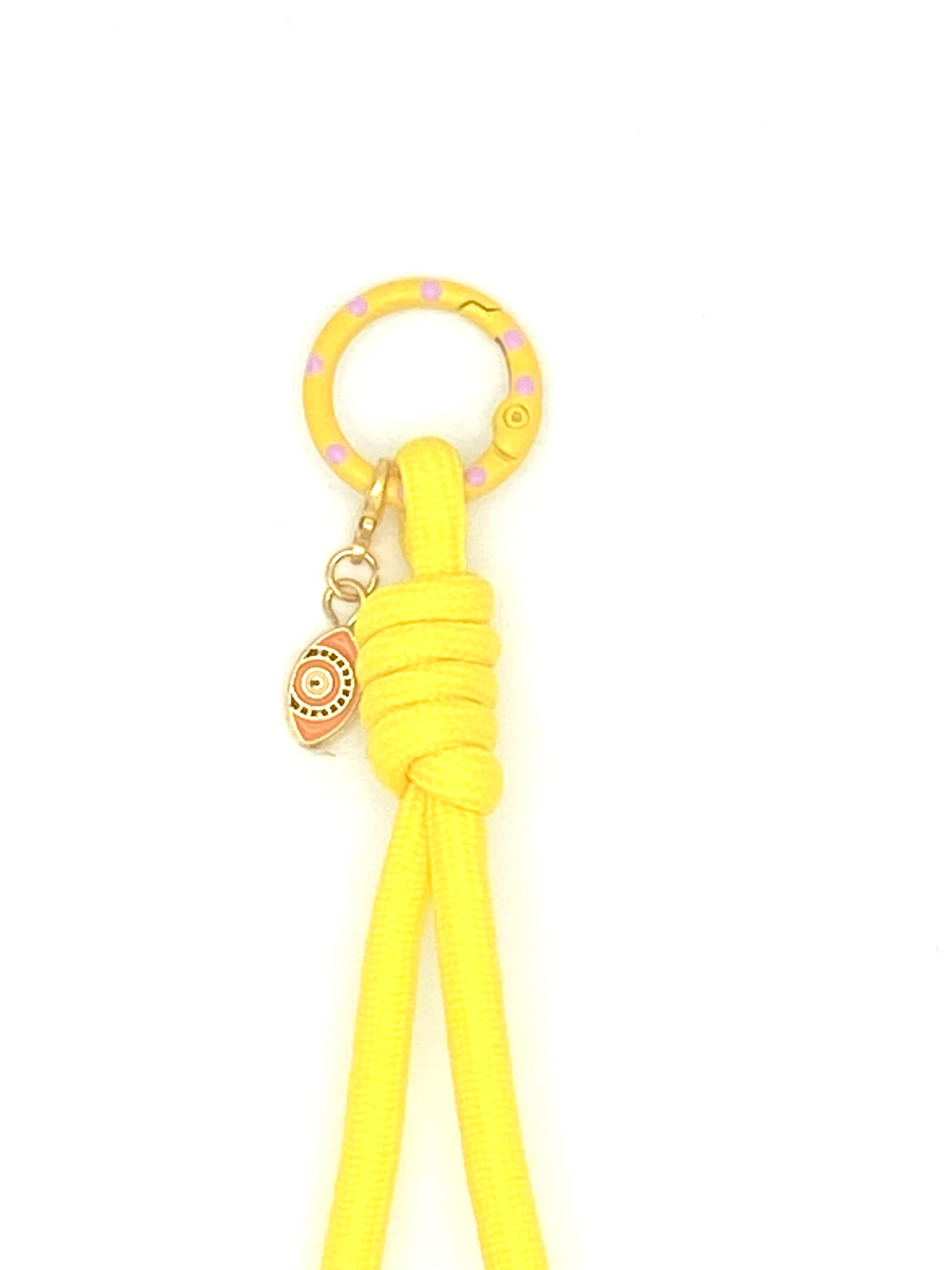 Porte clés en macramé jaune avec oeil