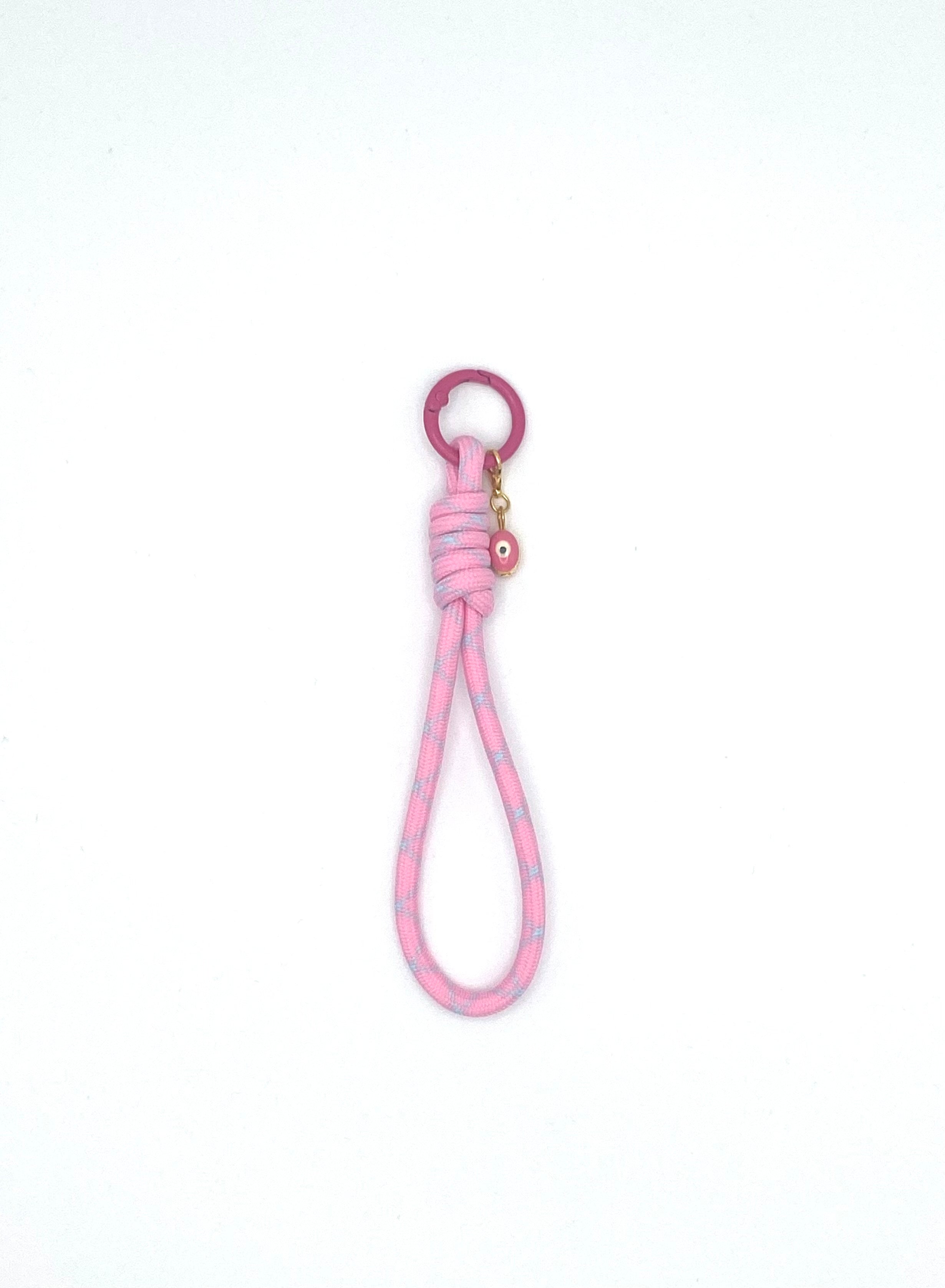 Porte clés en macramé rose et bleu avec oeil