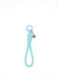 Porte clés en macramé bleu et jaune avec coquillage soleil