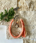 Grigri en macramé corail