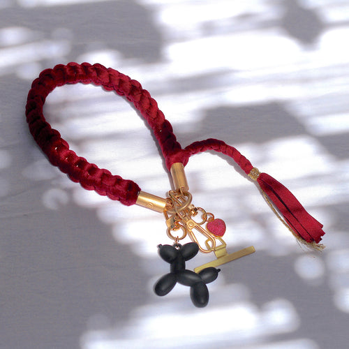 Grigri en macramé bordeaux et doré